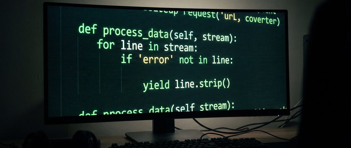 Monitor showing Python code on a dark background